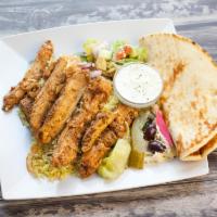 Chicken Shawarma Plate · Seasoned and grilled chicken breast served with tahini and garlic sauce. Comes with rice, Gr...