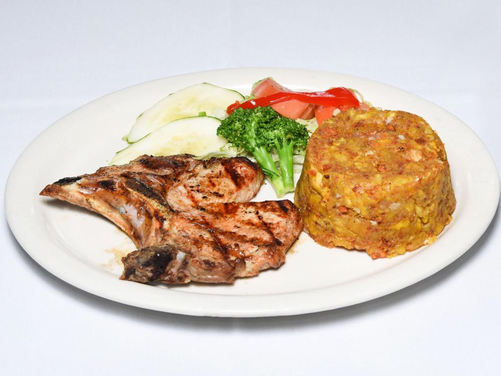Broiled Pork Chops · Succulent chops broiled just right. Served with a choice of side.