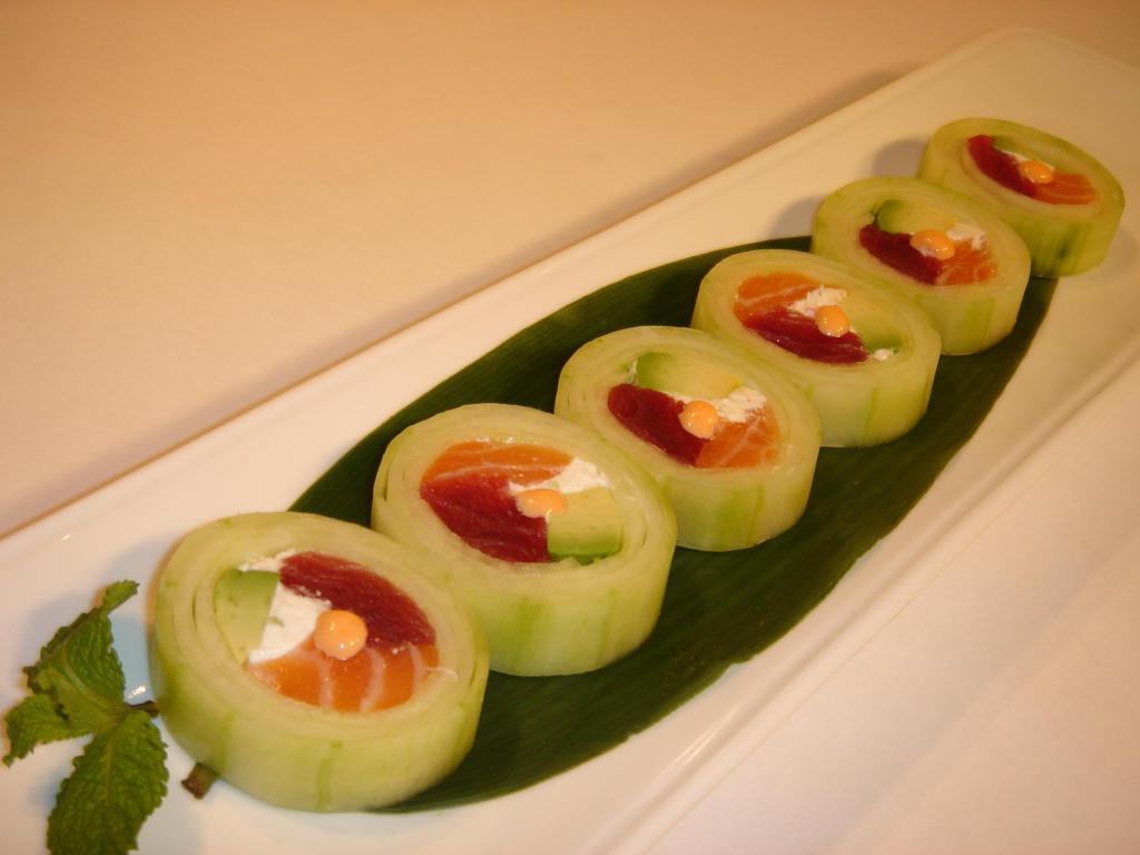 Fresh Summer Roll · Raw. Tuna, salmon, cream cheese, and avocado rolled in cucumber with spicy mayo on top light vinegar sauce.