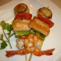 Kushi Yaki · Choice of seafood, chicken or beef, grilled with vegetables on a skewer. Served with teriyak...