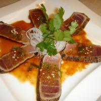 Beef Tataki · Raw. Torched beef served with ponzu sauce.