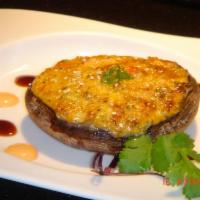 Shiitake Kaiyaki Special · Crab, scallops, flying fish roe, and spicy mayo baked on a portabella mushroom.
