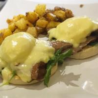 Steak & Egg Benedict · Grilled Flank Steak, Poached Eggs on English Muffin Topped with Hollandaise Sauce Served wit...