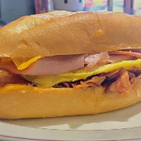 GMB Delight · Honey ham, turkey, bacon, melted cheddar cheese and scrambled eggs in soft roll. Served all ...