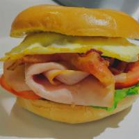 Bagel Club Sandwich · Fried Eggs, Thinly Sliced Turkey, Lettuce, Tomato, Crispy Bacon, Avocado & Mayo