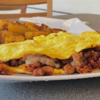 Mexican Omelet · Mexican chorizo, melted pepper jack cheese and pinto beans. Served with toast and home style...