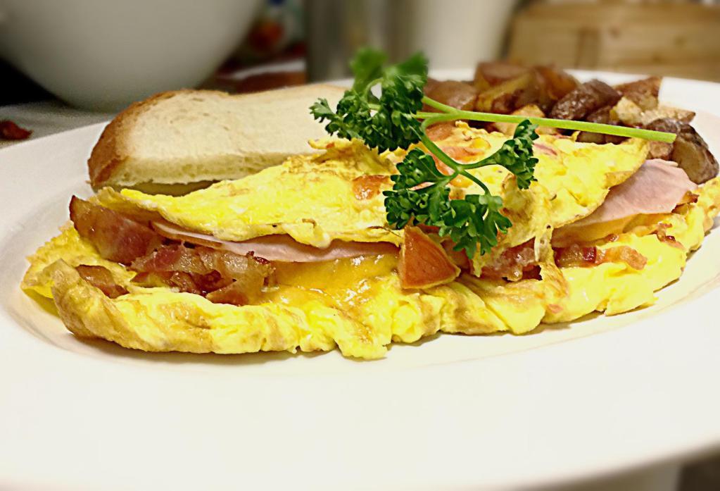 New Yorker Omelette · Honey Ham, Bacon, Tomato and Cheddar Cheese