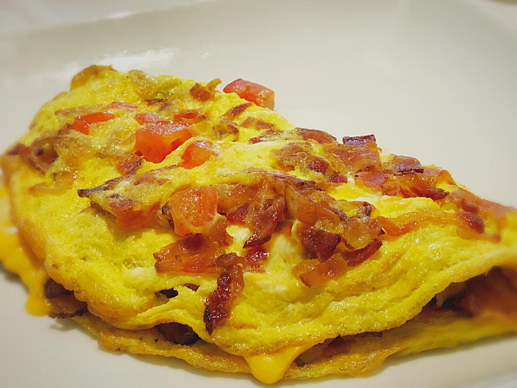 New Jersey Omelette · Crispy bacon, chopped tomato, melted American cheese.