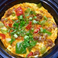 Chorizo and Chives Frittata · Mexican chorizo, bell pepper, onions, eggs, chopped chives and melted cheese. Served with ba...