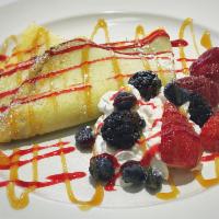 Berries & Cream · Dessert crepe filled with Nutella, topped with berries and whipped cream