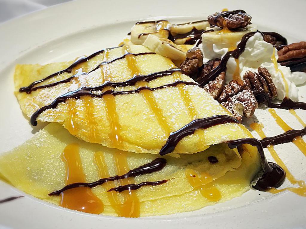 Banana Pecan Crepe · Dessert crepe filled with Nutella, topped with banana, toasted pecan halves and whipped cream