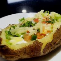 Classic Baked Potato · Topped with sour cream, shredded jack cheese, green onion, tomato, and jalapeno