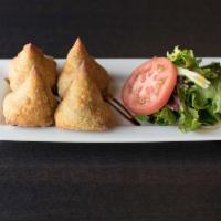 Bikaneri Samosa · Golden fried flaky pastry filled with peas and carrot.