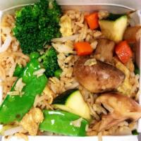 Veggie Fried Rice · Steamed rice stir fried with eggs, peas, carrots and green onions. 