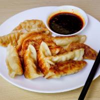 Fried Pot Stickers · Pan fried traditional northern Chinese dumplings with chicken and cabbage filling