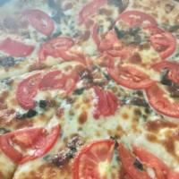 Margarita Pizza · Basil, tomatoes, garlic, olive oil and mozzarella cheese.