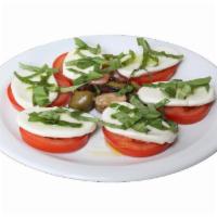 Caprese Salad · Vine tomatoes, fresh mozzarella cheese, juliennne cut fresh basil, Greek olives, extra virgi...
