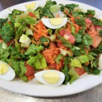 Primavera Salad · Lettuce, tomatoes, carrots and boiled eggs.