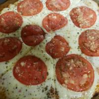 Napolitana Pizza · Made with tomato sauce, fresh mozzarella cheese, tomatoes, garlic and oregano.