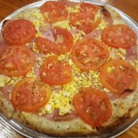 Special Neapolitan Pizza · Made with tomato sauce, fresh mozzarella cheese, ham, tomatoes, garlic, boiled eggs and oreg...