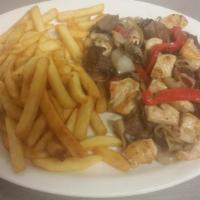 Planchita Mixta · Sauteed onions, peppers, bacon, mushrooms, chicken and steak. Served with fries.