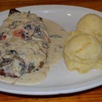 Steak and Mushrooms · Served with mashed potatoes.