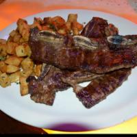 Asado de Tira · Short ribs. Served with french fries.