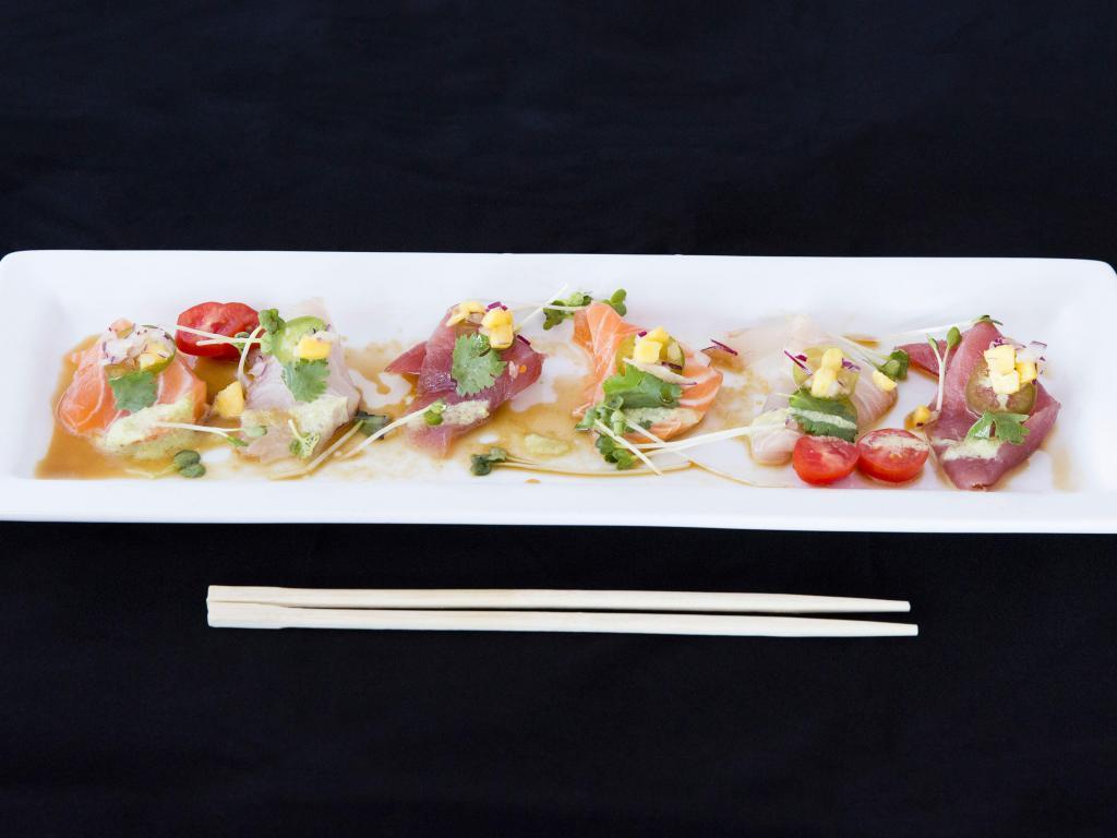New Style Sashimi · Two salmon, two tuna, two yellowtail, jalapeno and cilantro with ponzu.