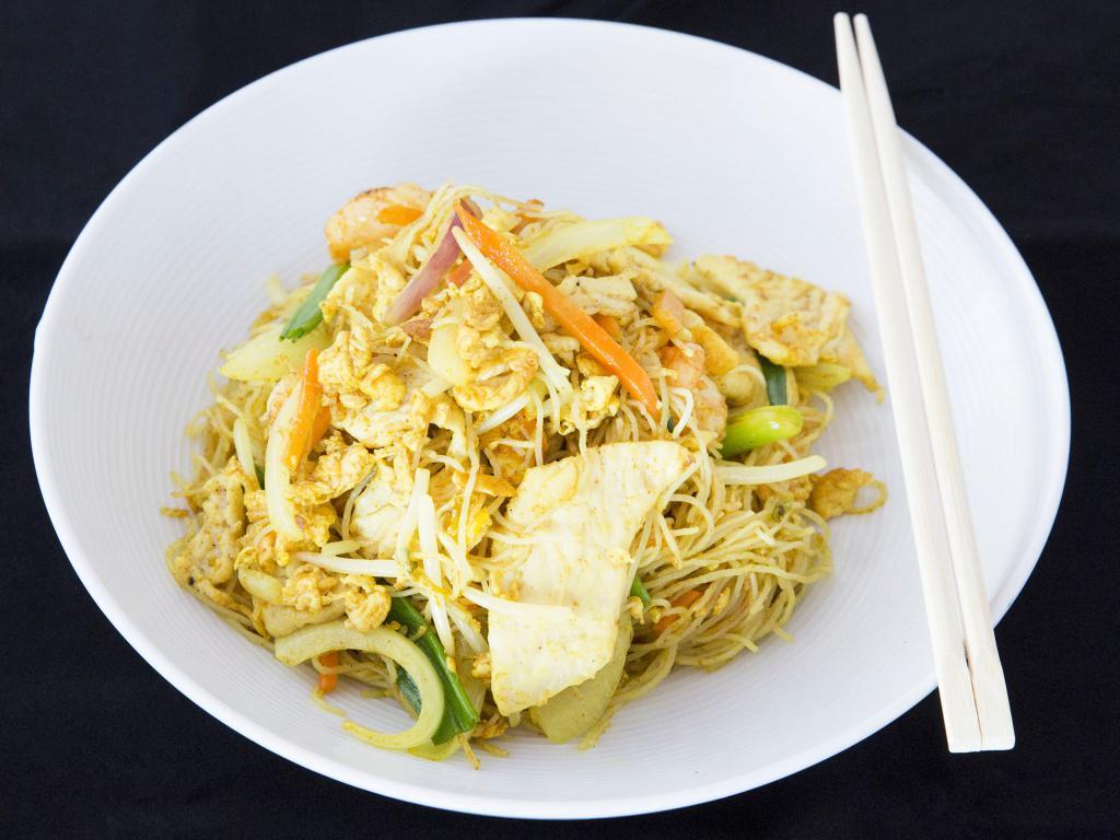 Singapore Rice Noodles · Thin rice noodles with shrimp and chicken in a spicy curry sauce.