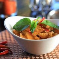 Red Curry · Red curry paste with bamboo shoot, bell peppers, basil and coconut milk.