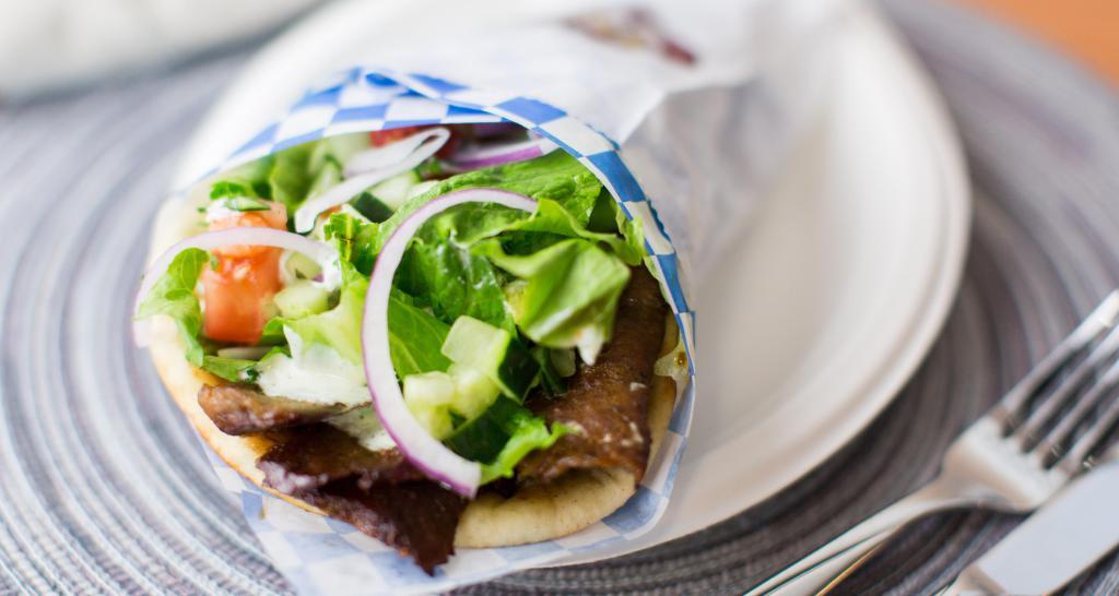 Lamb & Beef Gyro Pita · With choice of sauce. Served with lettuce, tomatoes, onion, cucumber, and parsley.