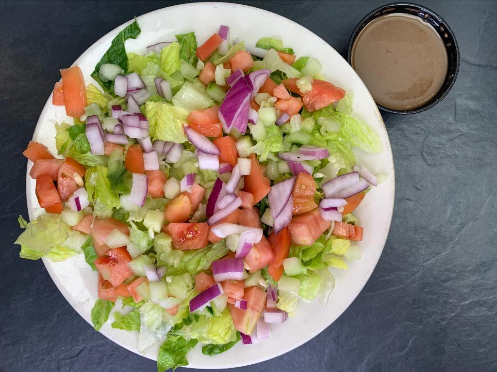 Tossed Salad · lettuce, tomatoes, cucumber and red onions. Balsamic vinaigrette on the side. Served with homemade garlic bread