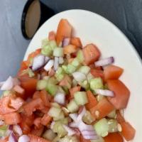 Israeli Salad · Chopped tomatoes, cucumbers, and red onions Israeli dressing on the side (olive oil, lemon, ...