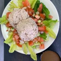 Tuna Salad · lettuce, tomatoes, cucumbers, red onions and dabs of tuna fish salad 
on top. Served with ho...