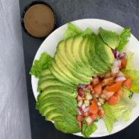 Avocado Salad · lettuce, tomatoes, cucumbers, red onions, whole avocado sliced. Served with our homemade gar...