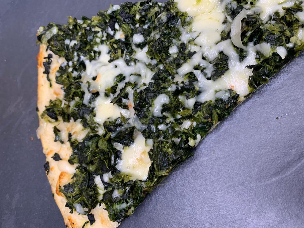 Spinach Pie · Fresh spinach, ricotta, mozzarella and sauteed onions finished with garlic sauce.