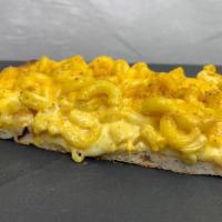 Mac and Cheese Pizza · Thin square crust, bed of mozzarella, mac and cheese topped with crunchy oreganata.