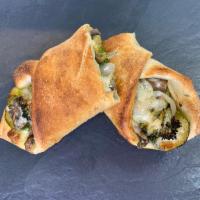 Vegetable Roll · Broccoli, zucchini, caramelized onions and mushrooms with garlic sauce and cheese.
