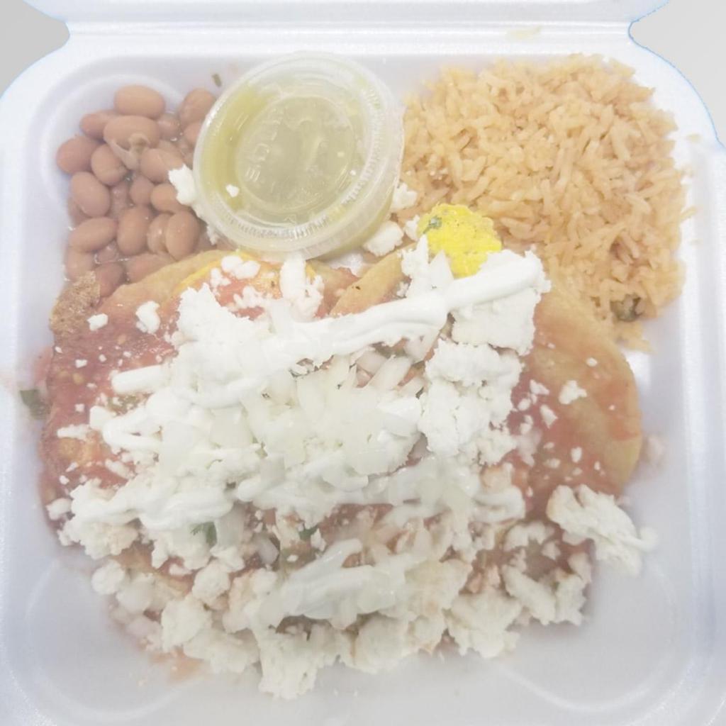 Huevos Rancheros · 2 crispy scrambled eggs, cheese, sour cream, and ranchero sauce. Served with rice, beans, and tortillas.