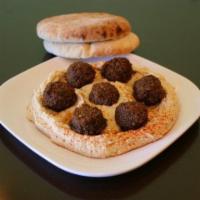 Falafel Platter · Served on a bed of hummus with a side of tahini.