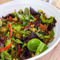 Fire Salad · Mesclun mix, red and green peppers, jalapenos, roasted corn, tomatoes, sun-dried tomatoes an...