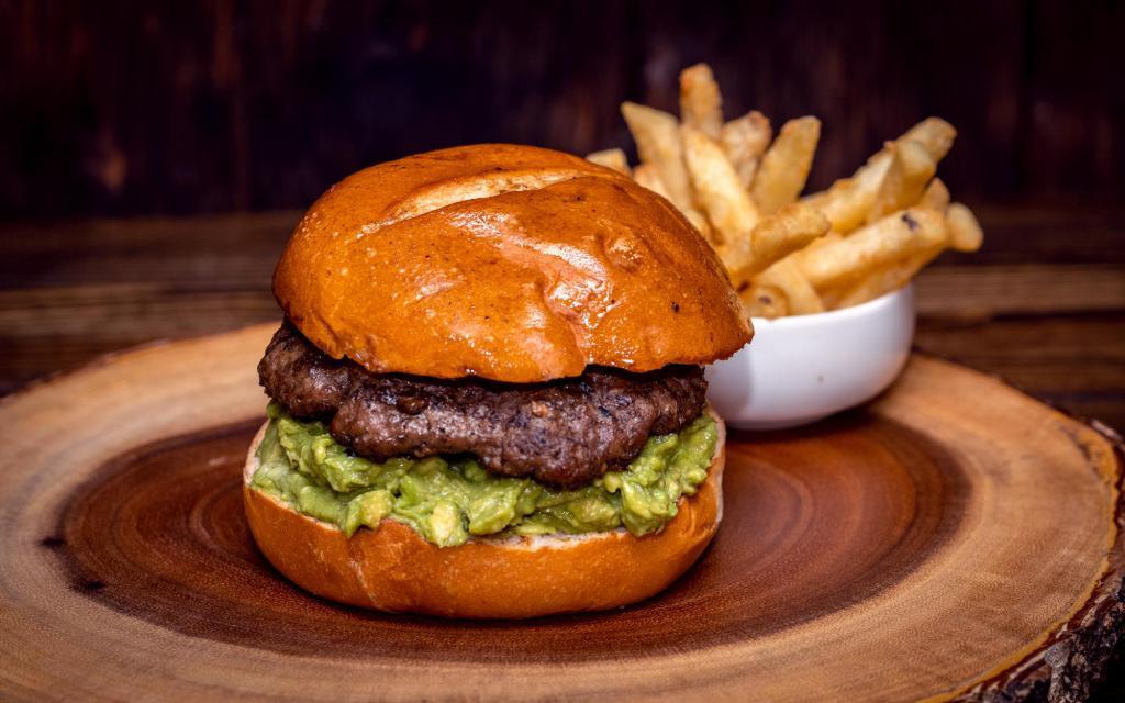 Holy Guacamole Burger · Served on a bun with your choice of lettuce, pickles, tomatoes, fresh or sauteed onions, grilled pastrami, bacon, sauteed mushrooms and holy sauce.