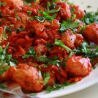 Chicken 65 · This spicy one is pan-fried chicken sauteed with curry leaves, sambal and garlic with aroma ...