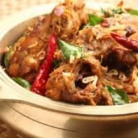 Chicken Chettinad · South Indian delicacy prepared in peppercorn and onion sauce. Served with rice.