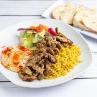 Chicken Shawerma Platter · Includes rice, hummus, side salad and pita bread.