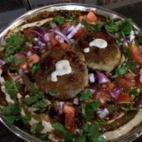 Aloo Tikki Chaat · Small potato patty with fresh tomatoes, onions, yogurt sauce, chickpeas, and topped with chu...