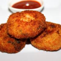 Delhi Aloo Tikki X 5 · Fried spiced potato patties. Served with Mint and Tamirind Chutneys