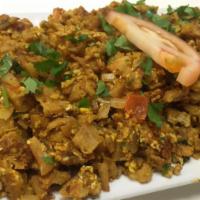 Egg Kothu Parotta · Minced Kothu parotta with spiced egg curry