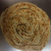 Lacha Paratha · Flaky thick whole wheat flour based flatbread.