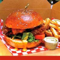 Fried Chicken Sandwich · Fried chicken breast, lettuce, tomato and Sarza Criolla, Aji Amarillo spread and mayo-ketchu...